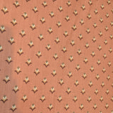 Fabric for the Art Deco Welding Hat featuring a terracotta background with repeating geometric pattern inspired by 1920s art deco design — handcrafted by HD Welding Hats.