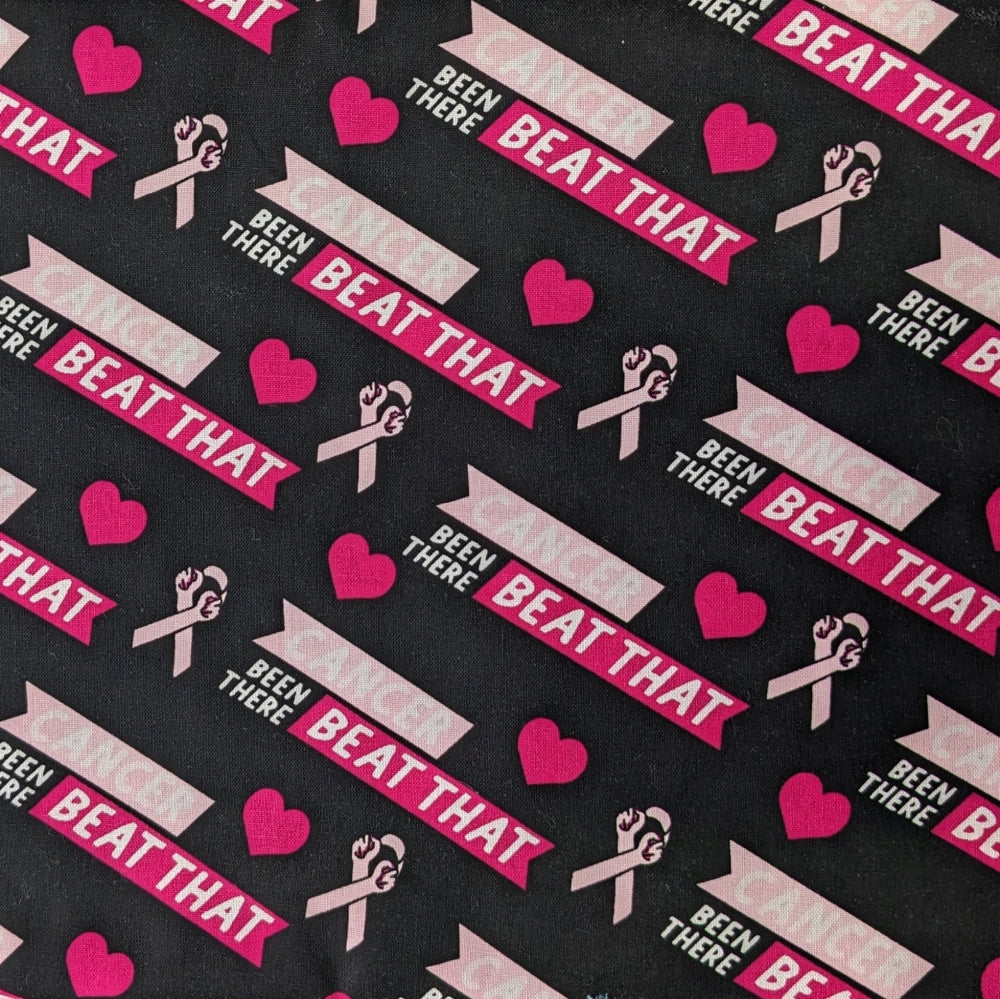 Fabric for the Been There Beat That Welding Cap featuring pink hearts, awareness ribbons, and “Cancer – Been There Beat That” text on a black background — handcrafted by HD Welding Hats.