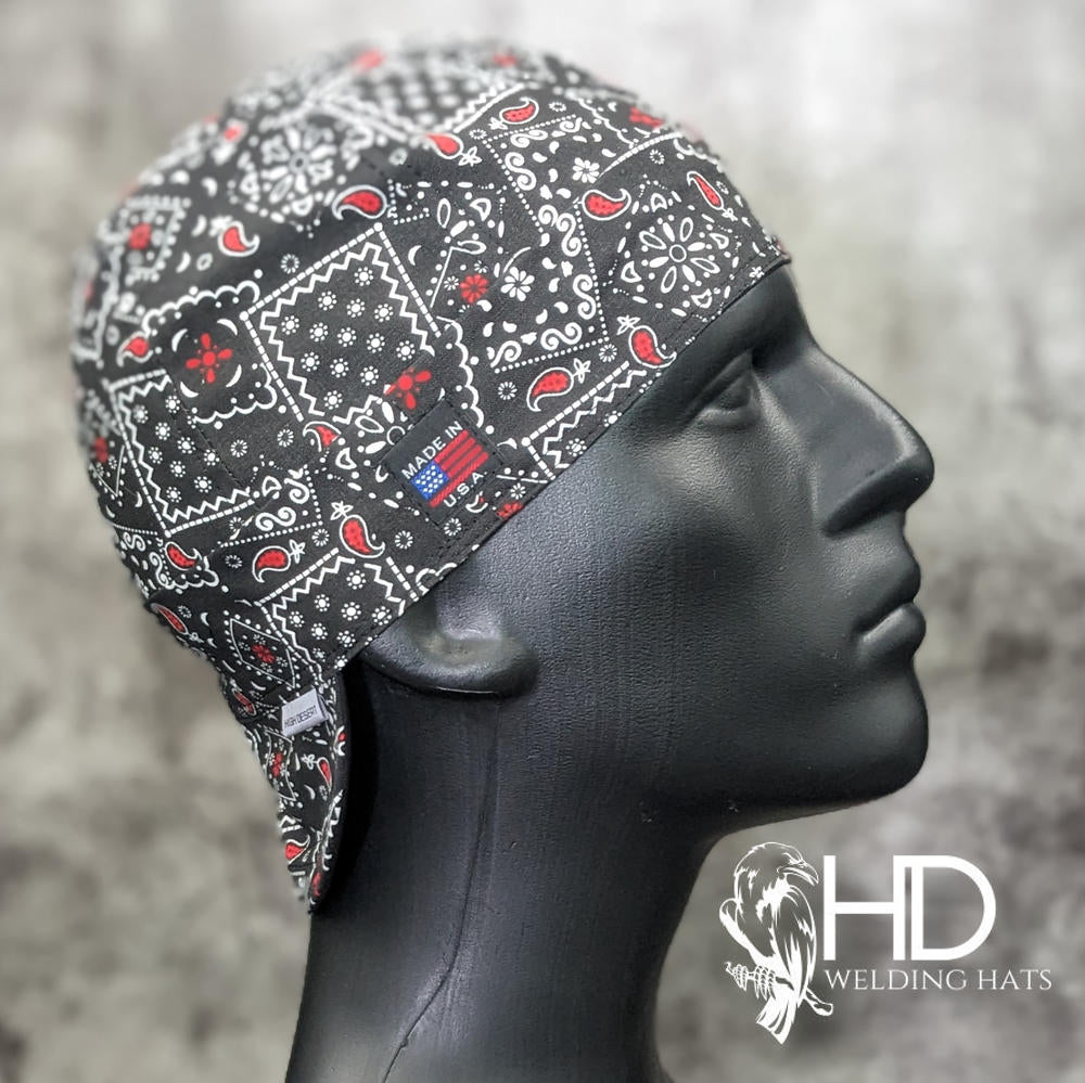 Side view of the Black & Red Bandanna Welding Cap featuring a black cotton fabric with red and white paisley bandanna pattern — handcrafted by HD Welding Hats.