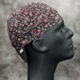 Side view of the Black & Red Paisley Bandanna Welding Cap featuring a red and white paisley pattern on black cotton fabric — handcrafted by HD Welding Hats.