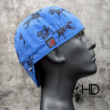 Blue welding cap featuring black cowboy roper silhouettes, handcrafted by HD Welding Hats from preshrunk cotton with FR denim brim.