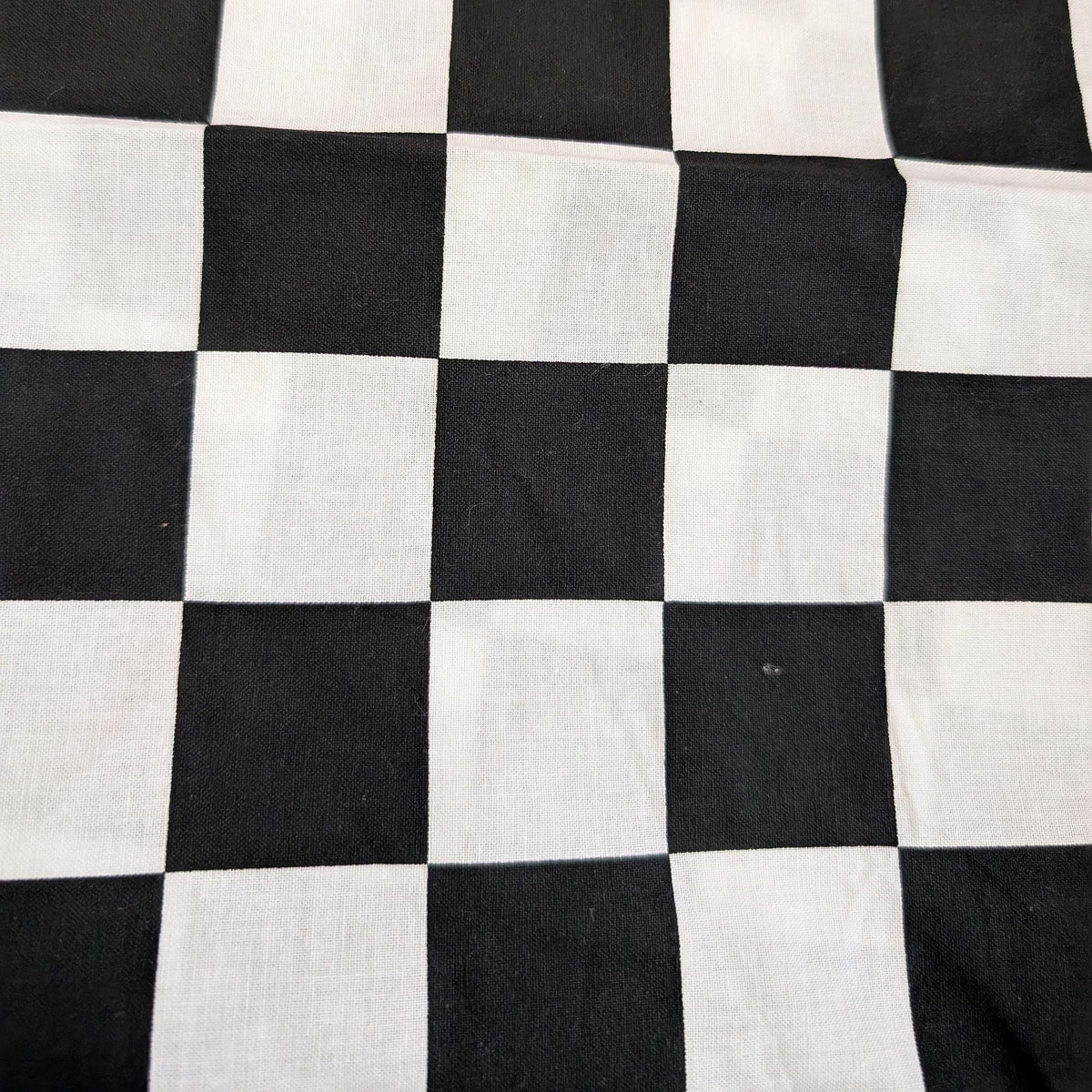 Close-up of black-and-white checkered cotton fabric used for the HD Welding Hats Checkered Flag Welding Hat.