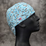 Frontier Paisley Winter Welding Cap featuring light blue cotton fabric with brown and white paisley design, handcrafted by HD Welding Hats with FR denim brim.