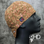 Black Forest Welding Cap featuring brown cotton fabric with red and tan paisley swirls, handcrafted by HD Welding Hats with a fire-resistant denim brim.