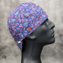 Frontier Paisley Blueberry Welding Cap – blue cotton welding hat with pink and aqua paisley print and FR denim brim, handmade in the USA by HD Welding Hats.