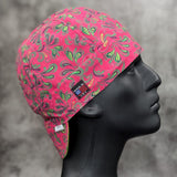 Frontier Paisley Fuchsia Welding Cap – pink fuchsia cotton welding hat with green and gold paisley print and FR denim brim, handmade in the USA by HD Welding Hats.