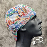 Go West Welding Cap featuring a colorful western-themed cotton print with cowboy and Route 66 imagery, handcrafted by HD Welding Hats with FR denim brim.
