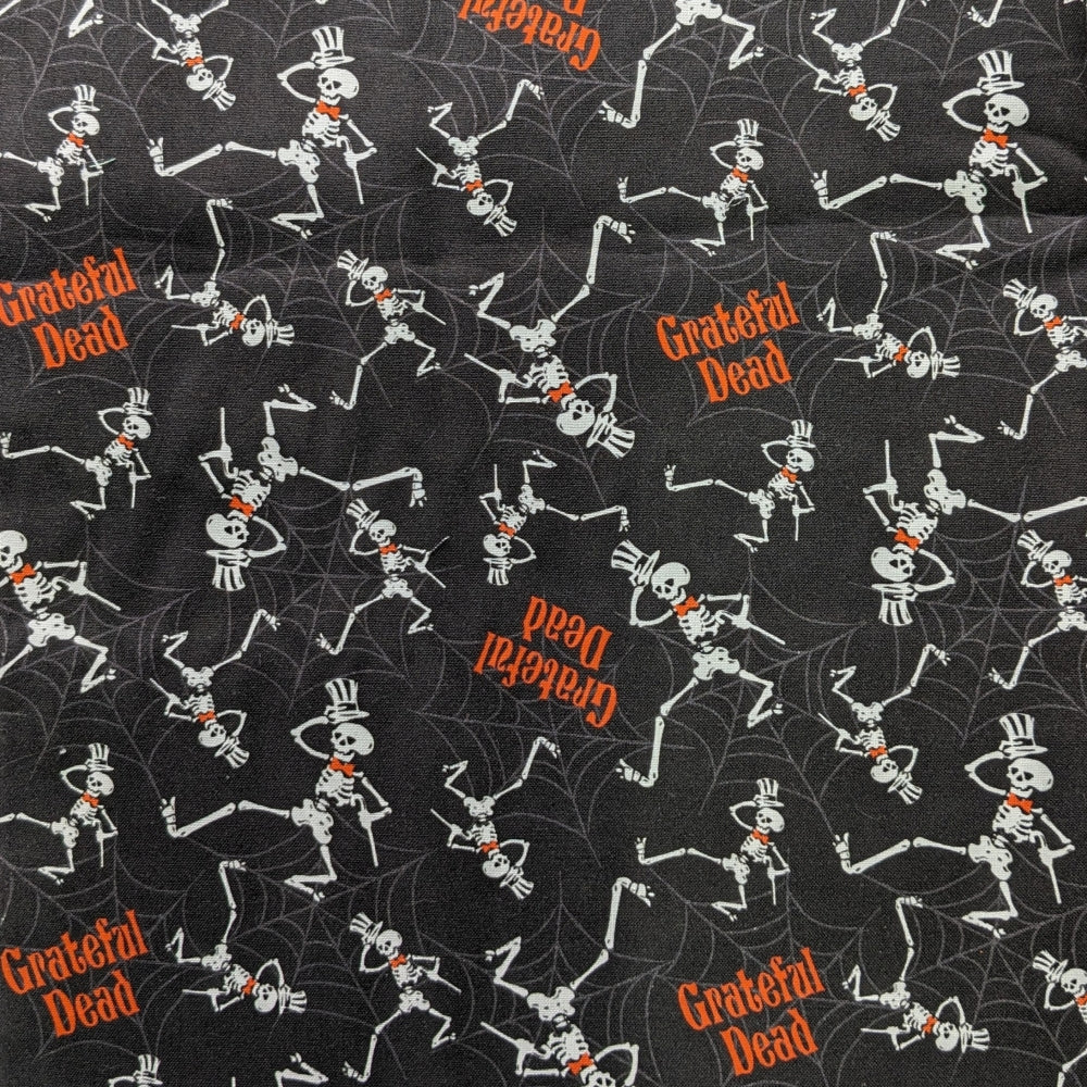 Grateful Dead Welding Cap with black fabric featuring dancing skeletons and orange lettering, handmade by HD Welding Hats with FR denim brim.