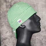 Green and white houndstooth welding cap handcrafted by HD Welding Hats with FR denim brim, cotton lining, and Made in USA label.