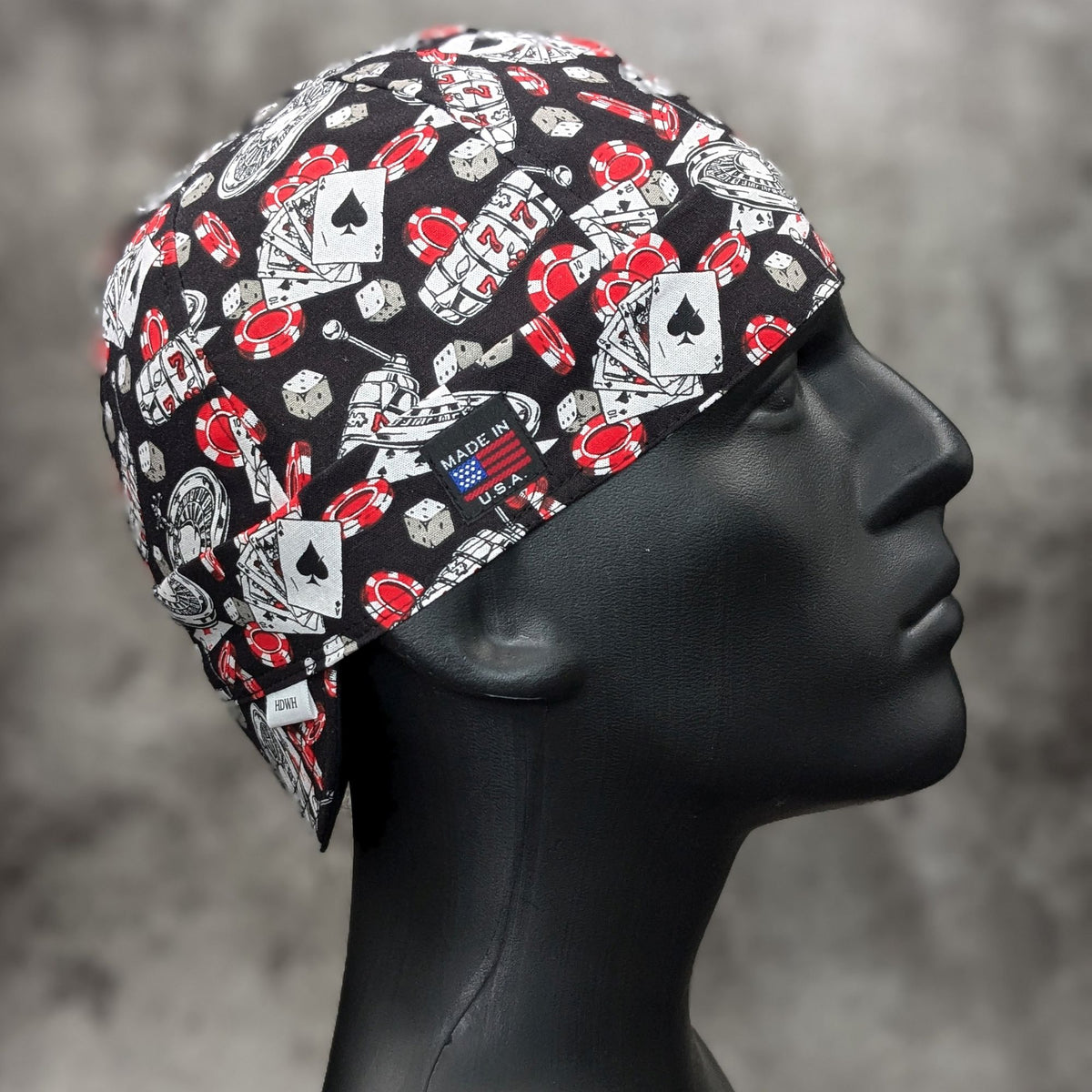 Jackpot Welding Cap with casino print featuring dice, poker chips and playing cards. handmade in the USA by HD Welding Hats.