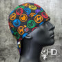 Marvel Badge Welding Cap with colorful superhero emblems on black cotton, handmade in the USA by HD Welding Hats with FR denim brim.