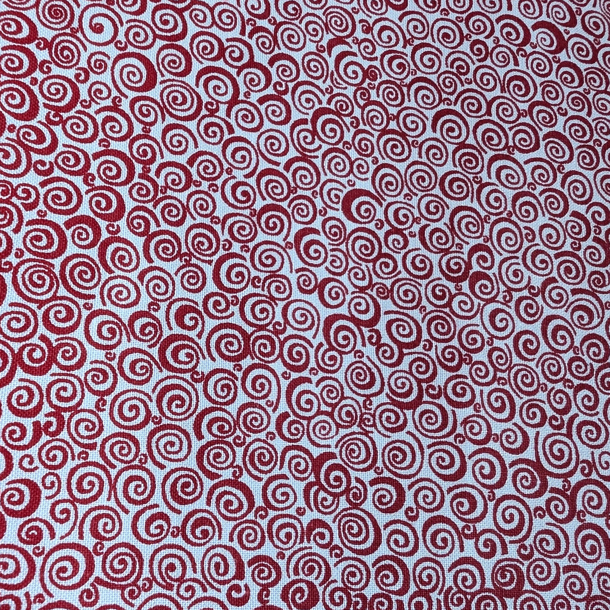 Red Curls Welding Cap fabric featuring red spiral curls on a white cotton background, handcrafted by HD Welding Hats with fire-resistant denim brim.