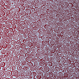 Red Curls Welding Cap fabric featuring red spiral curls on a white cotton background, handcrafted by HD Welding Hats with fire-resistant denim brim.