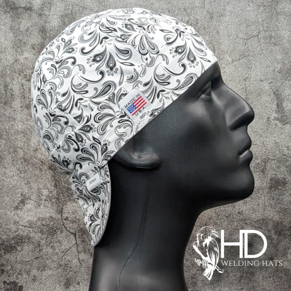 Frontier Paisley White Welding Cap featuring white cotton fabric with black and gray paisley design, handcrafted by HD Welding Hats with FR denim brim.