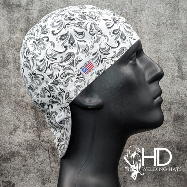 Frontier Paisley White Welding Cap featuring white cotton fabric with black and gray paisley design, handcrafted by HD Welding Hats with FR denim brim.