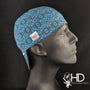 Side view of the Blue Serenity Welding Hat with an abstract blue pattern on dark fabric — handcrafted by HD Welding Hats.