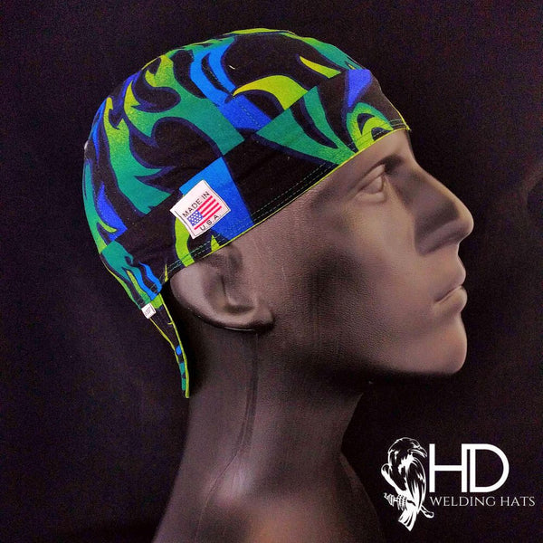 Hot Rod Flames Welding Cap with blue, green, and yellow flame design on black fabric, FR denim brim, and Made in USA label by HD Welding Hats.