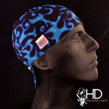 On Fire Black/Blue Welding Cap with electric blue flame pattern on black cotton, handmade in the USA by HD Welding Hats with FR denim brim.
