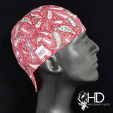 Burgundy Paisley Welding Cap with red, white, and pink paisley pattern, FR denim brim, and Made in USA tag, handcrafted from preshrunk cotton.