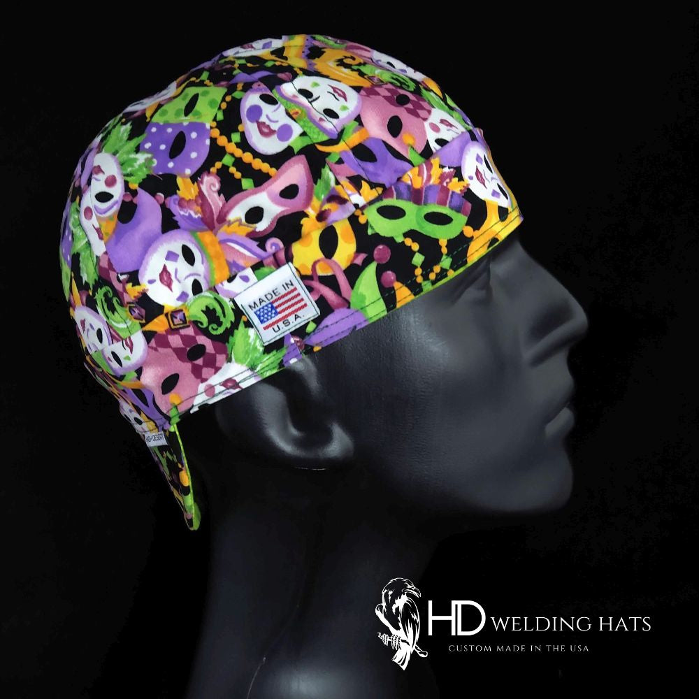 Mardi Gras Mask Welding Cap with colorful mask and bead pattern, made in the USA by HD Welding Hats, custom-fit with FR denim brim.