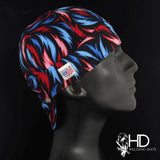 Fire & Ice Welding Cap featuring vivid red and blue flame pattern on black cotton with fire-resistant denim brim, handcrafted by HD Welding Hats.