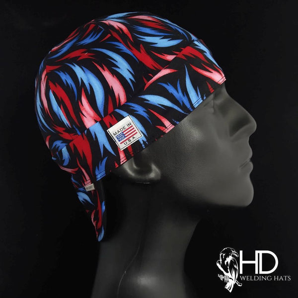 Fire & Ice Welding Cap featuring vivid red and blue flame pattern on black cotton with fire-resistant denim brim, handcrafted by HD Welding Hats.