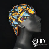 Side view of the Autumn Gold Welding Cap with jack-o’-lanterns, blue ghosts, and stars on black cotton — handcrafted by HD Welding Hats.