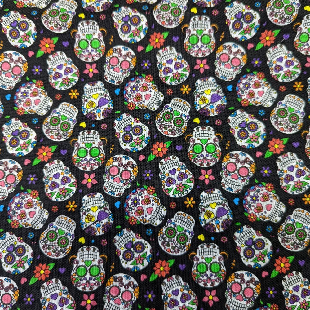 Close-up of colorful 1" sugar skull pattern on black cotton fabric used for HD Welding Hats’ Cantina Sugar Skulls Welding Cap.