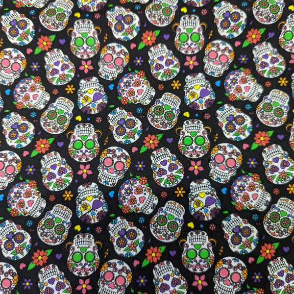 Close-up of colorful 1" sugar skull pattern on black cotton fabric used for HD Welding Hats’ Cantina Sugar Skulls Welding Cap.