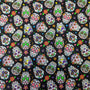 Close-up of colorful 1" sugar skull pattern on black cotton fabric used for HD Welding Hats’ Cantina Sugar Skulls Welding Cap.