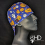 Side view of the Boo 2 You Welding Hat with a blue background and Halloween print featuring pumpkins and ghosts — handcrafted by HD Welding Hats.