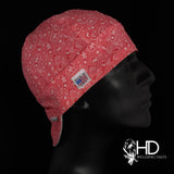 HD Welding Hats Coral Paisley Bandanna Welding Hat—coral-red cotton with white paisley print and FR denim brim, handcrafted in the USA.