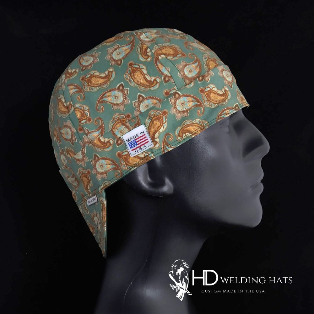 Indian Paisley Welding Cap with golden brown and turquoise paisley print, FR denim brim, and Made in USA label by HD Welding Hats.
