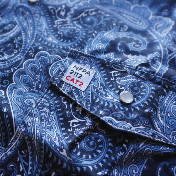 Blue paisley patterned shirt with NFPA 2112 CAT2 label on collar