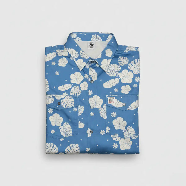 Folded blue shirt with white floral pattern on a light gray background