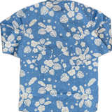 Blue shirt with white floral pattern on a white background