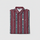 Folded FR cotton maroon shirt with geometric pattern on a light gray background