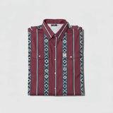 Folded FR cotton maroon shirt with geometric pattern on a light gray background