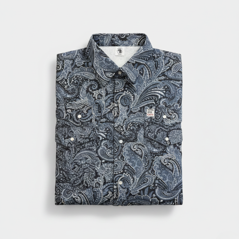 Folded shirt with a blue paisley pattern on a light gray background
