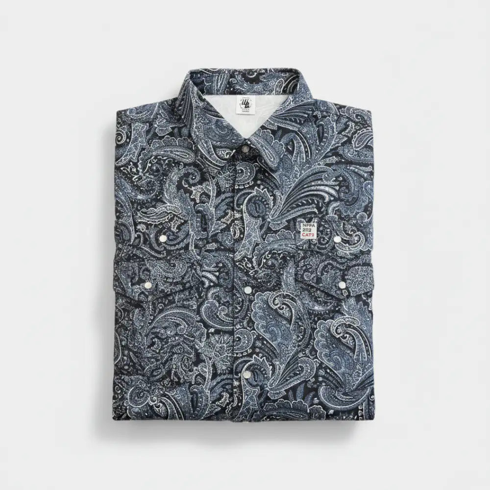 Folded shirt with a blue paisley pattern on a light gray background