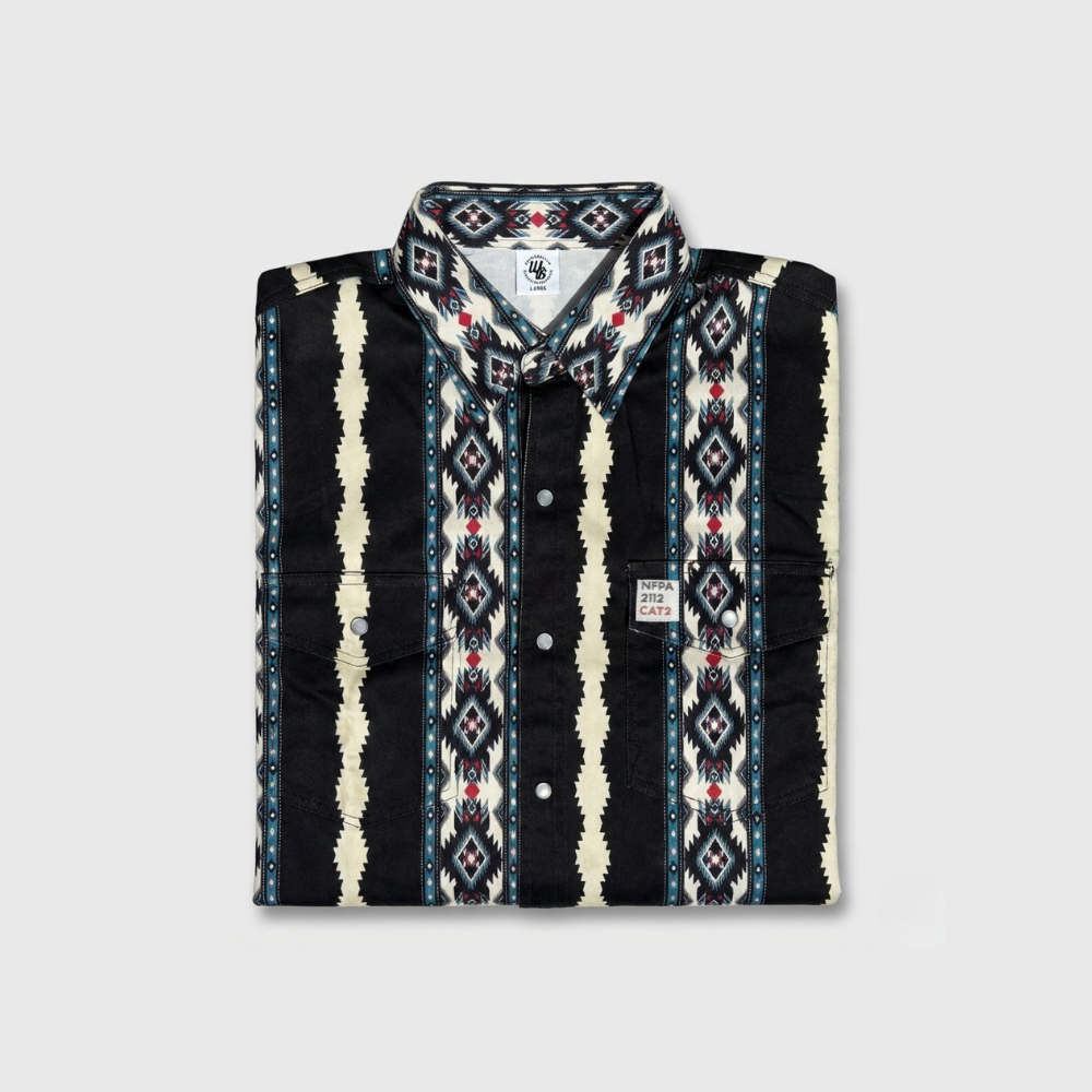 Folded patterned shirt with visible brand logo on a light gray background