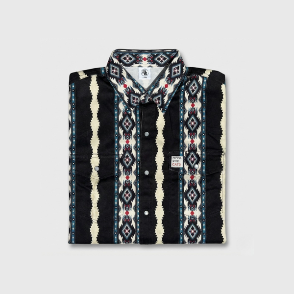 Folded patterned shirt with visible brand logo on a light gray background