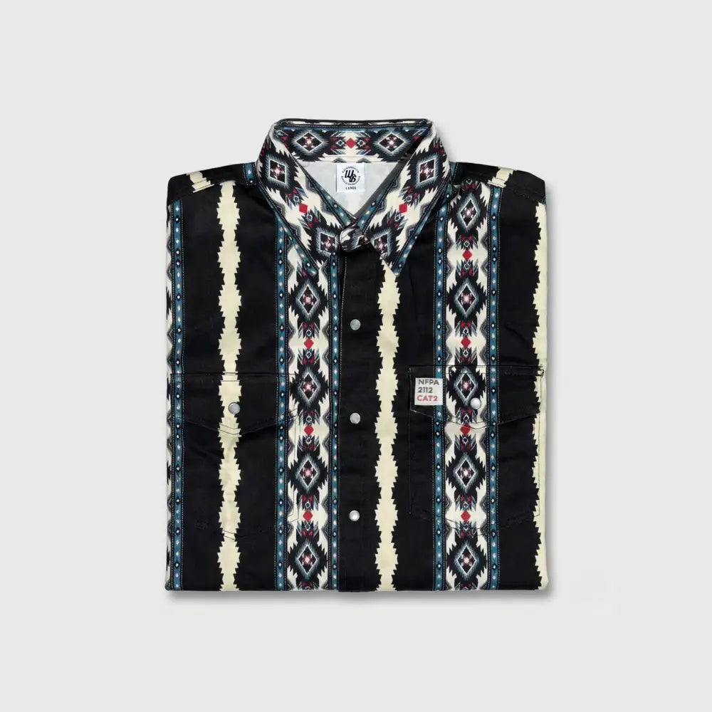 Folded patterned shirt with visible brand logo on a light gray background