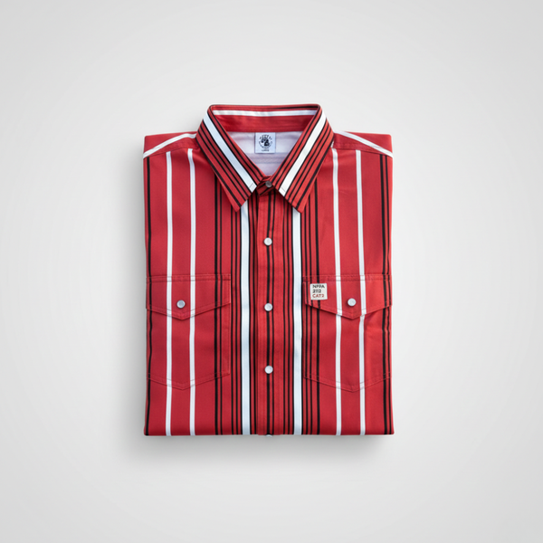 Folded red and white striped shirt on a light gray background