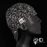 Side view of the Black Paisley Bandanna Welding Cap featuring a white paisley pattern on black cotton fabric — handcrafted by HD Welding Hats.